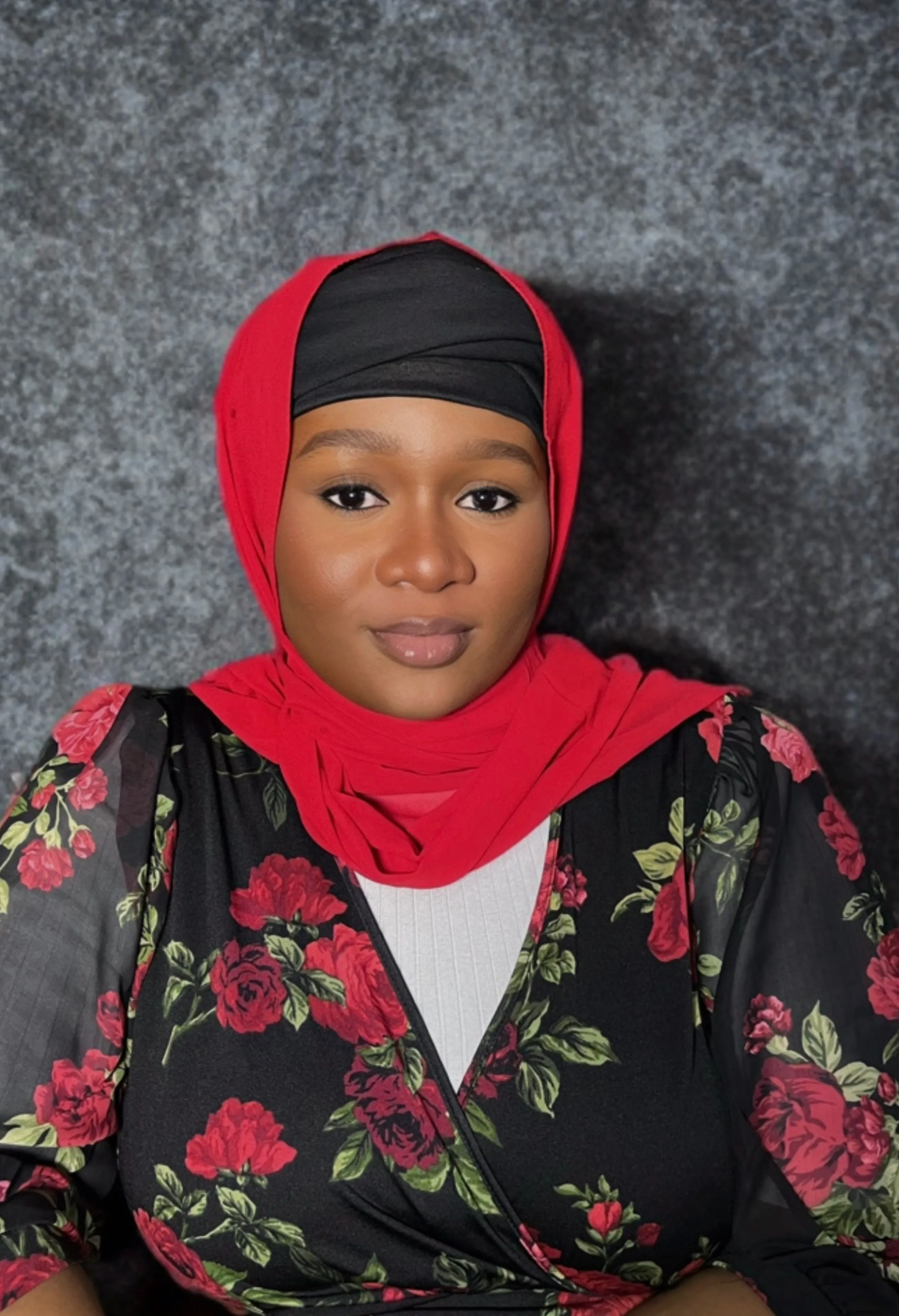 Khadijah Kabir working on a project, showcasing a focused and creative environment.